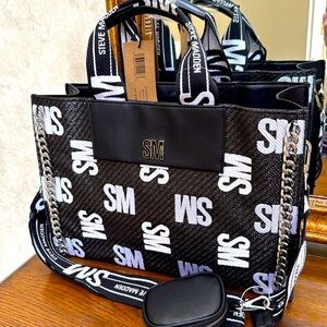 Stylish Steve Madden Black and White Tote/crossbody Bag.  Silver chain accents.